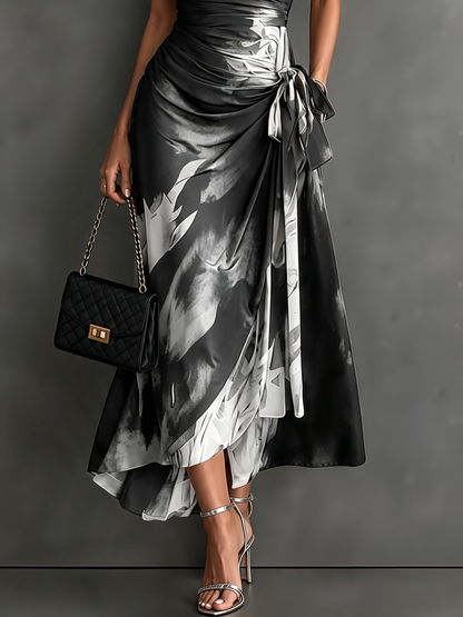 Rosalie | Vestido midi cruzado con estampado abstracto, escote en V, manga corta, cinturón y bajo asimétrico con volante